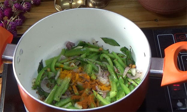 Add turmeric , red chilli powder