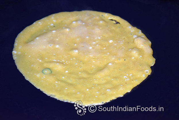 Pour over iron dosa pan / non-stick pan, pour 1 tbsp oil around the dosa
