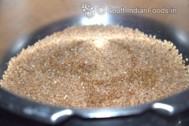 Heat pressure cooker add broken wheat, 1 tbsp oil, saute for 3 min