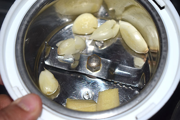 In a mixie jar add ginger & garlic