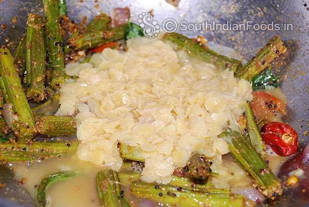 Add boiled toor dal & water mix well & let it boil. Then add tamarind water