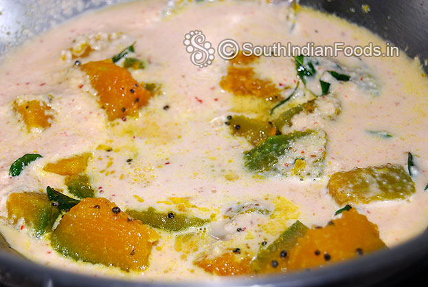 Add freshly ground coconut mixture, mix well & let it boil