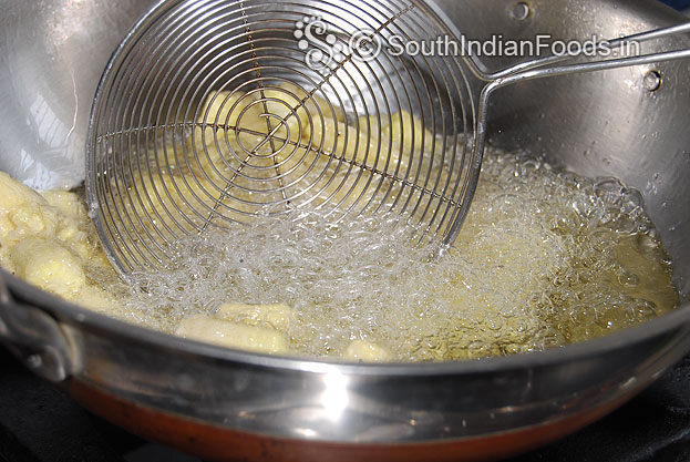 Heat oil in a pan, add baby corn, deep fry