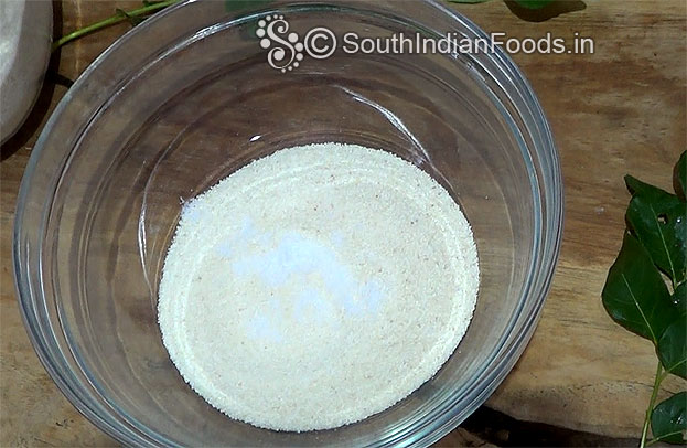 In a bowl add white rava & salt