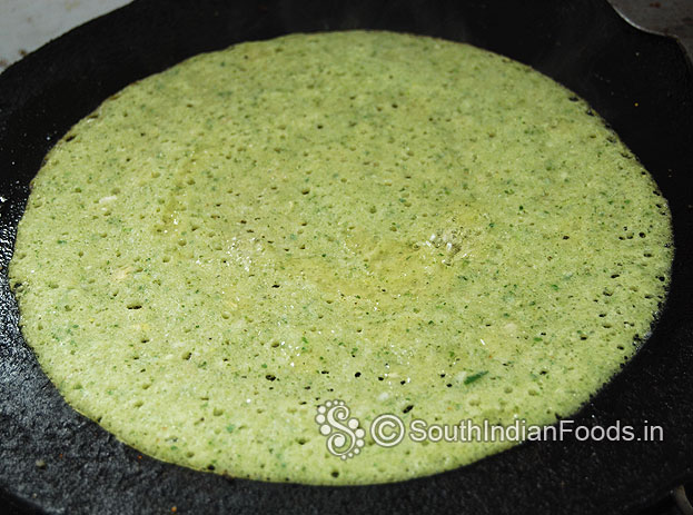 Pour oilaround the dosa, cook both sides till crisp