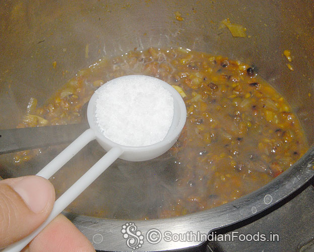 Heat pressure cooker add toor dal, tomato, onion, garlic, turmeric, green chilli, gingelly oil