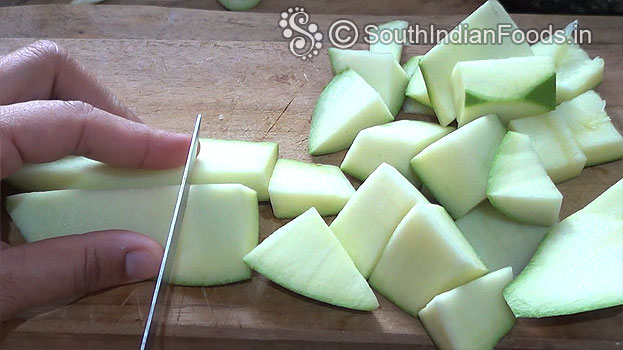 Cut raw mango into cubes