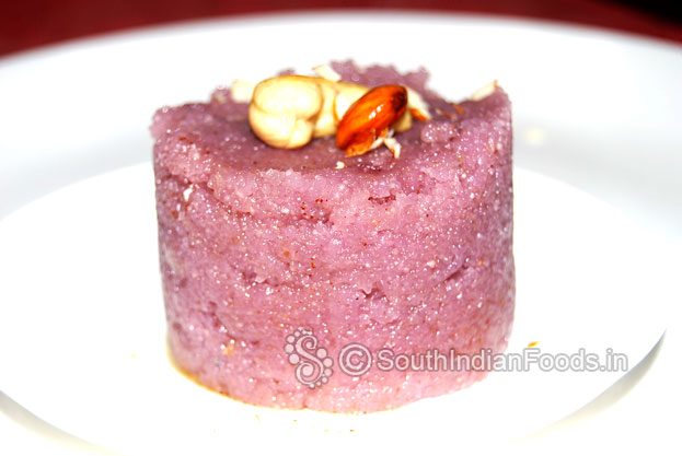 Transfer to serving plate, Garnish with almonds & cashews & serve hot