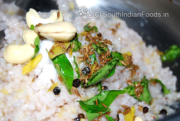 Add seasoned ingredients to cooked red rice mixture