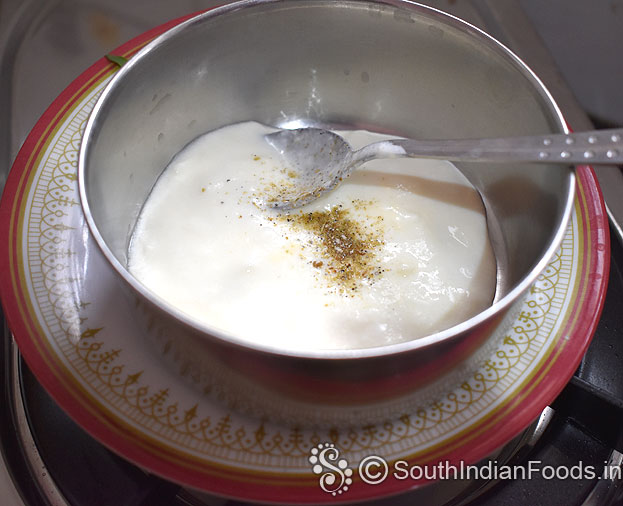 In a bowl add fresh curd, cardamom powder