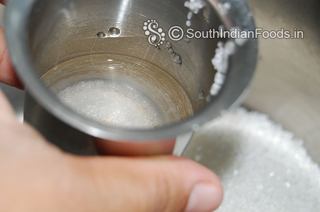 Add half cup water let it boil till half string consistency