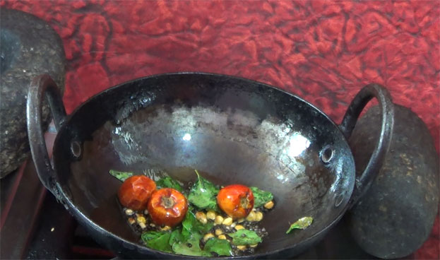 Heat oil, add mustard, chana dal, urad dal, curry leaves, dry red chilli, hing