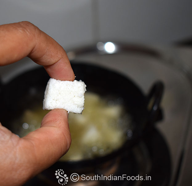 Heat oil in a pan, add idli cubes