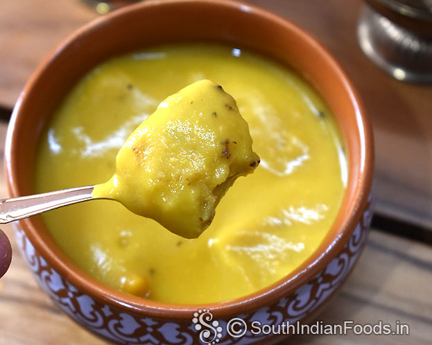 Crispy bread cubes in creamy carrot soup