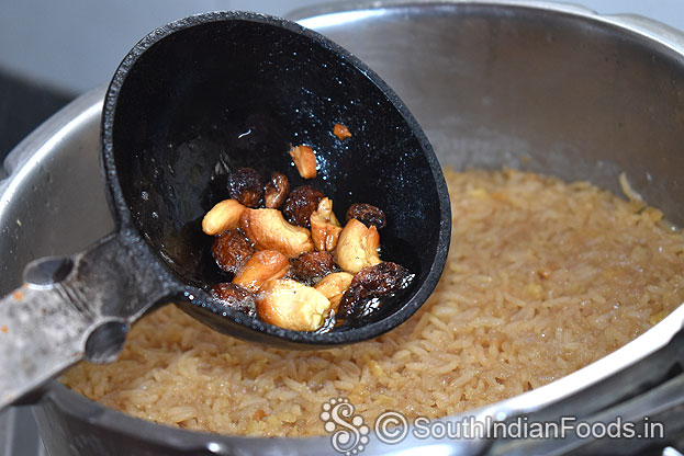 Add roasted cashew and raisins