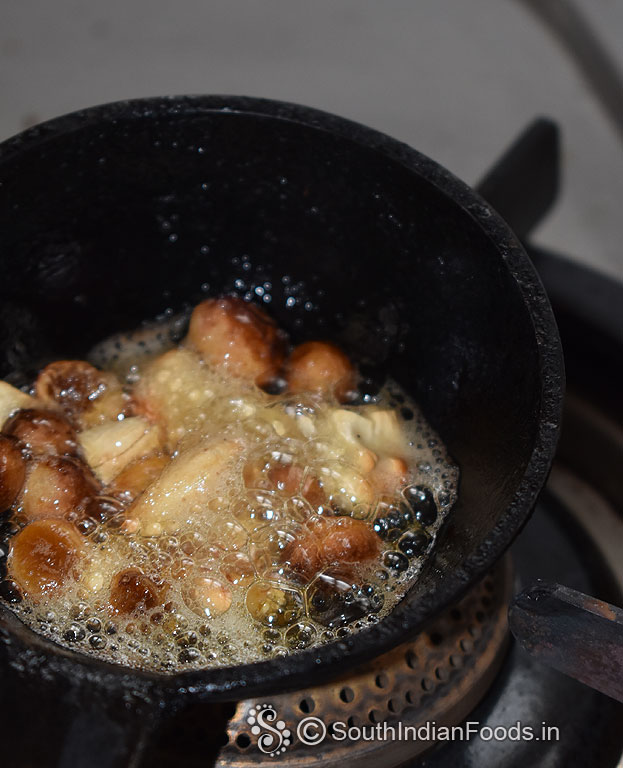 Heat 2 tbsp ghee, add cashews and raisins roast