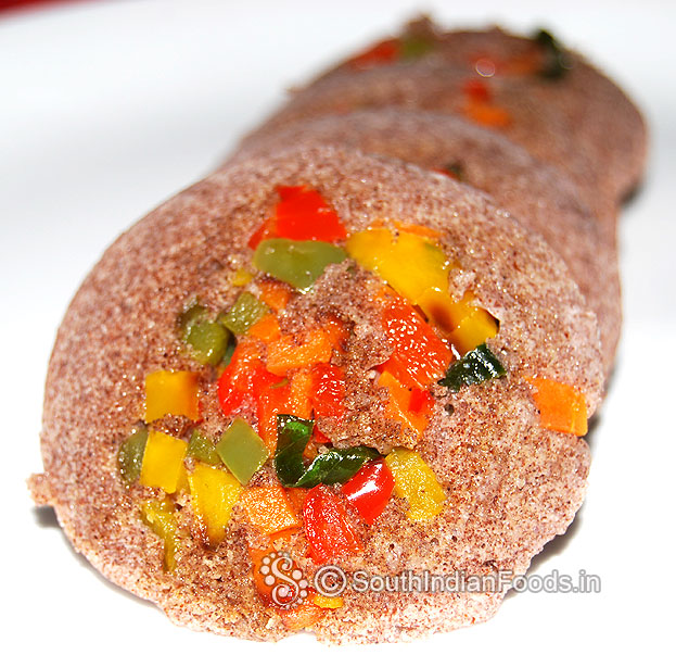 Kezhvaragu maavu idli with vegetables topping