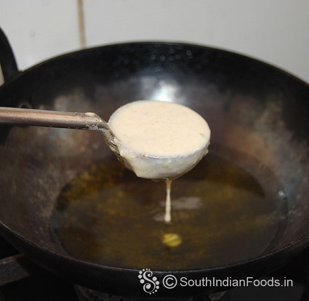 Heat oil, pour batter