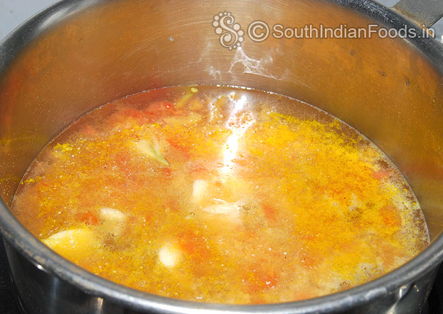 Heat toor dal mixture, add garlic, turmeric powder, asafetida, & Pepper&cumin powder