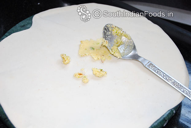 Divide the dough into equal size balls, sprinkle flour roll out into thin chapati then place ghee rice flour mixture spread evenly