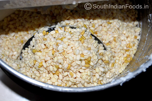 Add urad dal in a grinder and grind to fine batter.