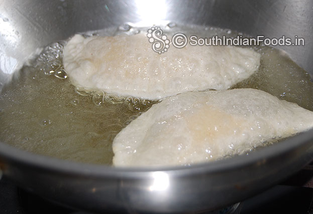 Heat oil put somas one by one deep fry till crisp and light brown on medium flame