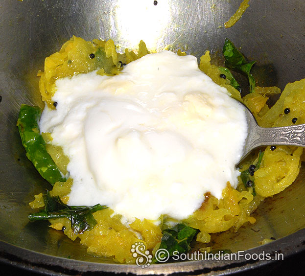 Add curd, mix well