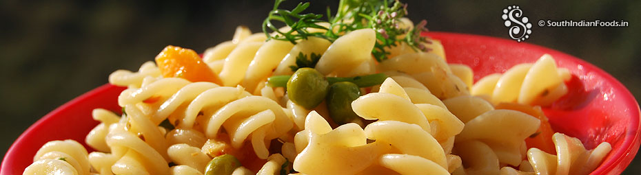 Masala fusilli pasta with carrots green peas